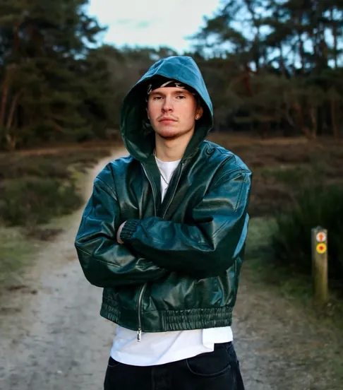 Portrait of Joeri Roozen (Joeri RZN) wearing a green leather jacket